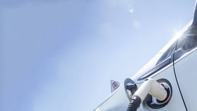 A fuel pump in the tank of a car under a blue sky