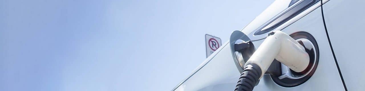 A fuel pump in the tank of a car under a blue sky