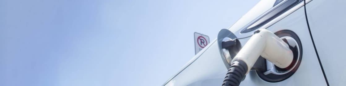 A fuel pump in the tank of a car under a blue sky